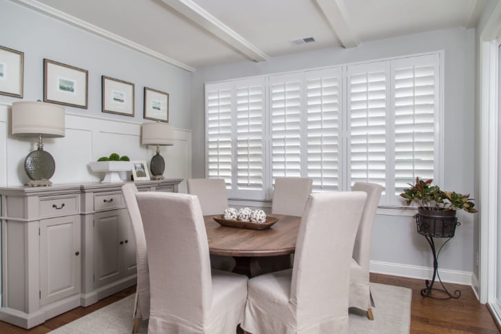 Dining room with white plantation shutters